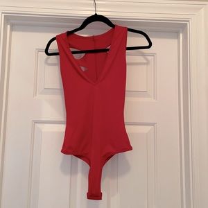 Slashed back red bodysuit. New never worn